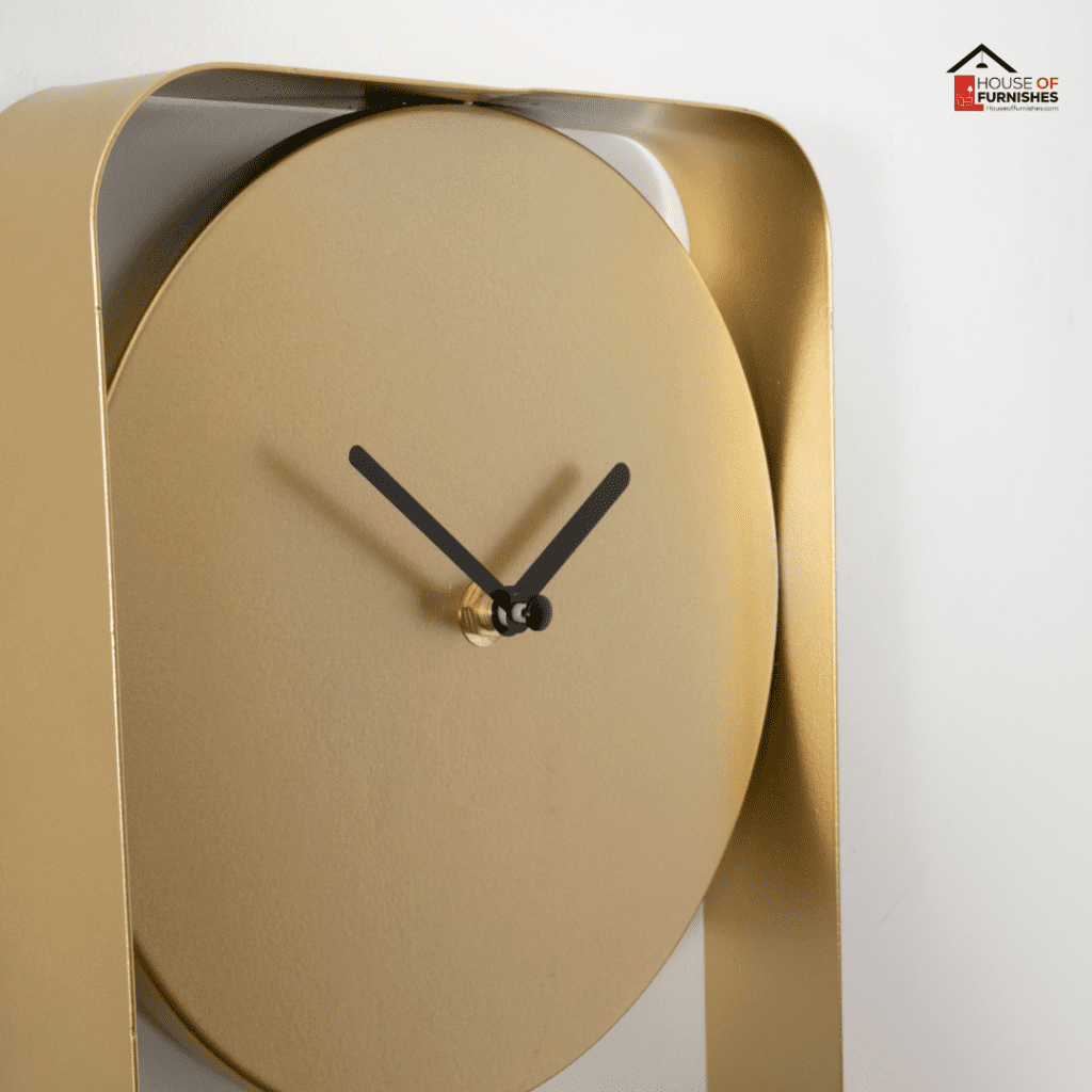 Modern Gold Metal Wall Clock Hanging on White Wall