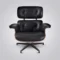 Full front view of the lounge chair charles eames and ottoman set in black leather.