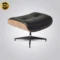 Close-up of Eames lounge chair replica ottoman in black ash wood and premium leather